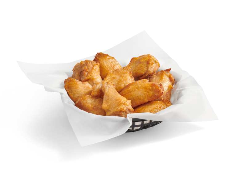 A full basket of crispy, bone-in chicken wings with no sauce.